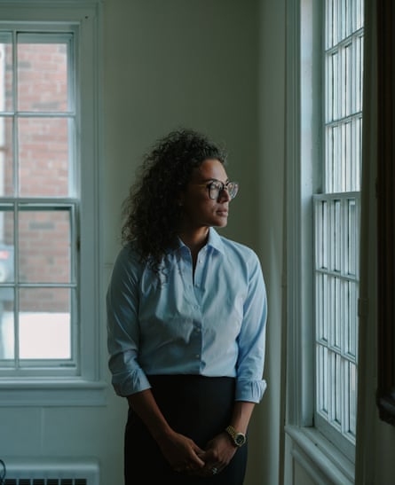 Amanda Miller, an attorney in Rhinebeck, New York, standing looking out of a window