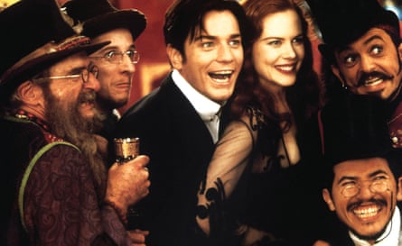 From left to right, Garry McDonald, Matthew Whittet, Ewan McGregor, Nicole Kidman, Jacek Koman, John Leguizamo are captured in a still from the movie Moulin Rouge!