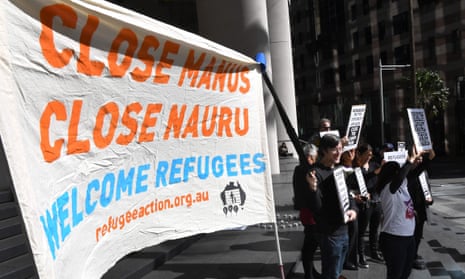 Human rights groups hold placards as they call for an independent inquiry outside the Commonwealth Government offices in Sydney on August 9, 2017, after another refugee was found dead at a detention camp in Papua New Guinea in a tragedy they said was preventable. Australia’s Human Rights Law Centre said the man was the fifth held on Manus Island to die since Canberra’s offshore regime began in July 2013.