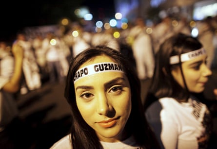 Young women wear headbands featuring the name of El Chapo during a march in Culiacan in February 2014.
