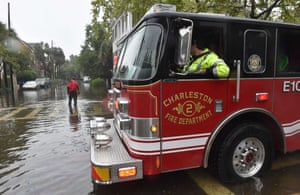 A firefighter checks the road in downtown Charleston