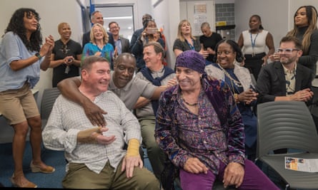 The E Street Band star with Dr Jonty Clark OBE (front left) who is the executive officer of the Beckmead Trust and who was one of the main instigators for the visit.
