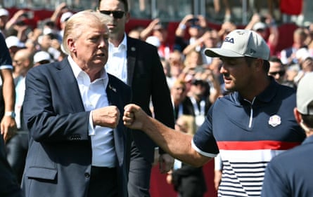 Donald Trump fist-bumps Bryson DeChambeau at the Ryder Cup.