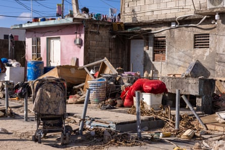 furniture and belongings in debris-filled street