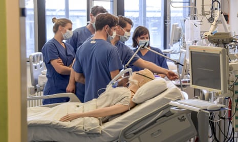 Doctors get instructions on a ventilator at the University Hospital Eppendorf in Hamburg Germany.