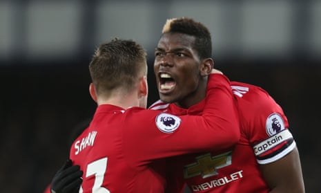 Paul Pogba celebrates with Luke Shaw after setting up Anthony Martial for Manchester United’s first goal at Everton