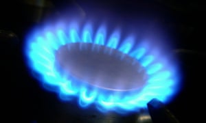Blue gas flame of a gas cooker against daark background