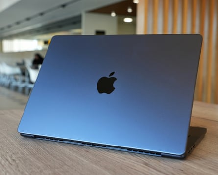 The lid of the M5 Pro MacBook Pro in black showing the Apple logo.