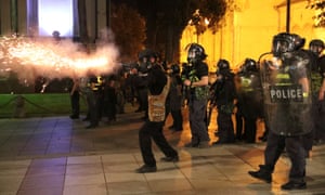 Riot policemen fire teargas during a rally against a Russian lawmaker’s visit in Tbilisi.