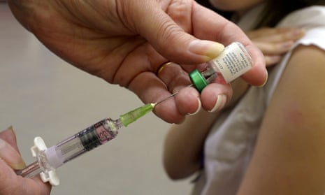 A measles vaccination being administered. 