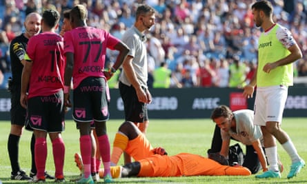 Clermont’s Mory Diaw lies on the ground after being injured by a firecracker during the game at Montpellier