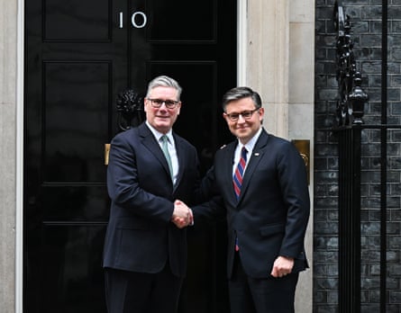 Keir Starmer and Mike Johnson shake hands outside No 10.