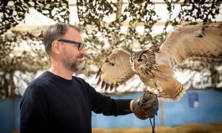 Tim Dowling handles Ozzie the owl at Houndslow Urban Farm.