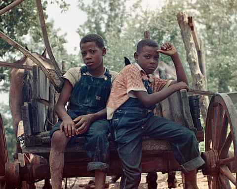 Two boys sitting on a wagon in Shady Grove, Alabama, 1956. Photograph by Gordon Parks.