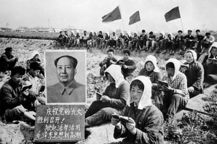 People gathered in a field around a portrait of Mao Zedong in Jiangsu province in 1969.