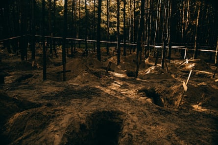 ‘It has made me hate any forest since’ … mass graves at Izium.