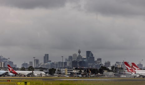 A view of Sydney’s CBD from the airport, with Qantas planes in the foreground 