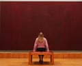 A woman looking at one of Mark Rothko's Seagram murals, 'Maroon on Maroon'.