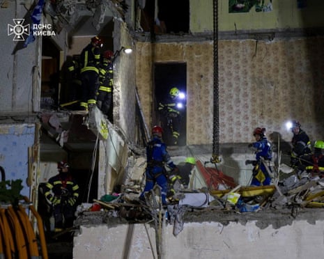 Rescuers work at the site of an apartment building which was hit a day before, by a Russian missile strike, amid Russia's attack on Ukraine, in Kyiv, Ukraine.