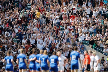 Fans in the record crowd of 58,498 watch England take on France