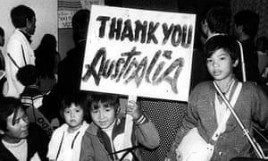 Young Vietnamese child holds up a sign, ‘Thank you Australia’