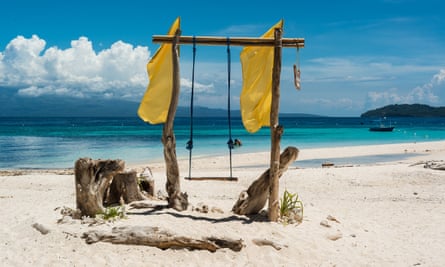 Wooden swing on the beach of a tropical paradise island. Yoga Scuba, Phillipines with Recconect Discover