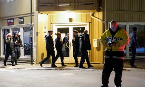 Police officers investigate at the scene after a bow and arrow attack killed five people in Norway.