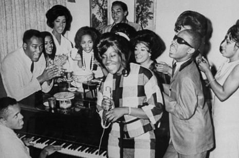 ‘We’re always gonna make quality records’ … Berry Gordy (bottom left) playing piano for a group including Smokey Robinson (at back) and Stevie Wonder (second right). 