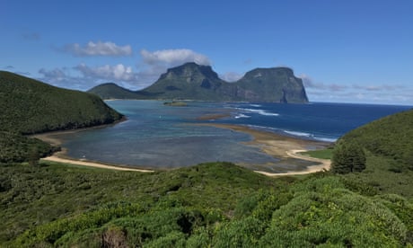 A view over forest and a bay across to the hills of Lord Howe island.