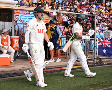 Openers Travis Head and Jake Weatherald head out onto the field of play.