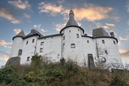 Clervaux Castle perched on a rocky promontory above the city, was destroyed during the Battle of the Bulge in the second world war and then rebuilt.