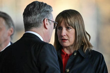 Starmer (L), with back to the camera, and Reeves chatting together