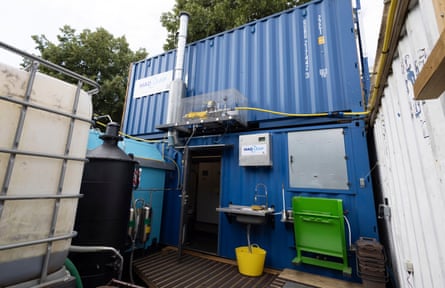 Exterior of R-Urban, a community powered sauna and allotment in Tower Hamlets, showing blue shipping container and other apparatus.