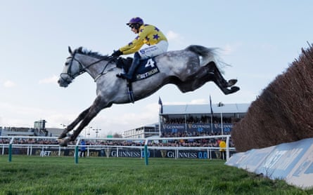 It Etait Temps clears the final fence on his way to winning the Queen Mother Champion Chase.