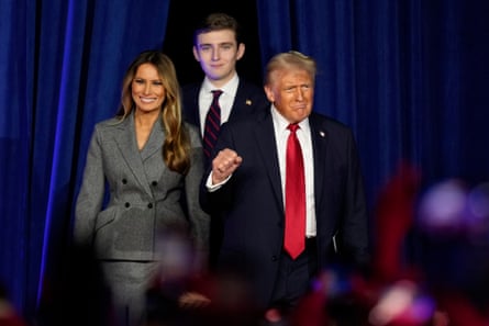 Republican presidential nominee former President Donald Trump, from right, joined by Melania Trump and Barron Trump, arrives to speaks at an election night watch party, in West Palm Beach, Florida.