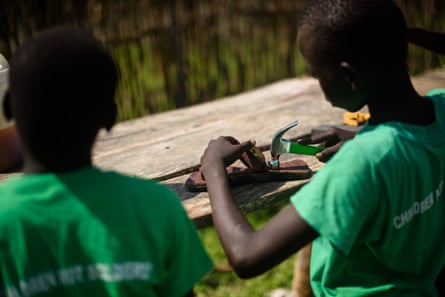Boys take part in a leatherwork skills session at the Pibor youth centre.