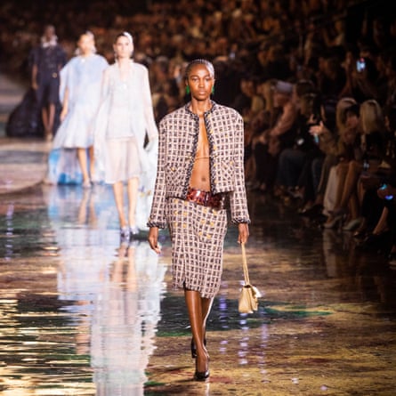 A Chanel classic suit with nothing underneath.