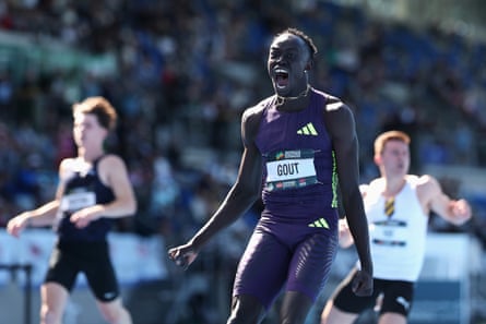 Gout Gout celebrates winning a race.