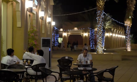 Men sitting outside a coffee shop in the Atturaif district on the outskirts of Riyadh, which is part of a major development project shepherded by King Salman.