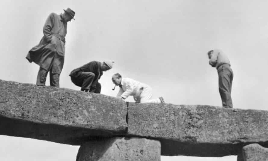 Photographs from the 1958 restoration project show people smoking pipes and wearing trilbies as they stand on top of stones.