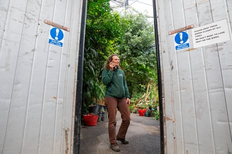 Catherine Cutler on her radio at the service entrance to the rainforest biome.