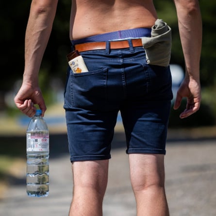 Parkgoer carrying water and suncream 