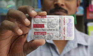 A chemist holds a pack of hydroxychloroquine tablets in Mumbai, India.