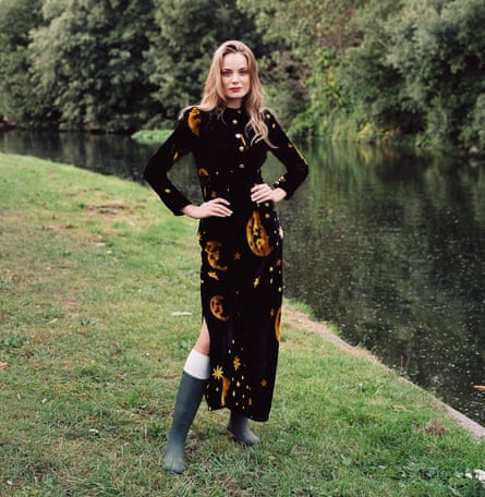 A model standing by a lake wearing the Celestial Moon velvet dress by the hot London label Farleigh.io