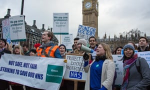 Junior
doctors outside parliament during their first strike over proposed
changes to pay and working hours.