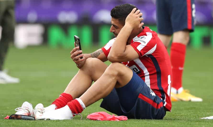 Luis Suárez speaks to his family on the phone after clinching the La Liga title with Atlético Madrid.