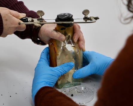 Museum workers saw off bottle top