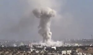 Video frame grab showing smoke after an airstrike on Haas, Syria.