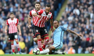 Southampton’s Nathan Redmond tackled by Manchester City’s Raheem Sterling.