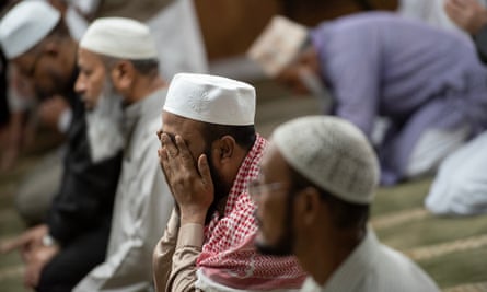 Muslim men pray at the Baitul Mukarram Mosque in 2018.
